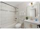 Updated bathroom featuring a shower-tub combination and modern fixtures, with bright natural light at 6601 E Latham St, Scottsdale, AZ 85257