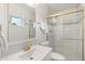 Modern bathroom featuring updated tile, gold fixtures, and a glass-enclosed shower at 6601 E Latham St, Scottsdale, AZ 85257