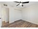 Simple empty bedroom with wood floors and double-door closet at 6601 E Latham St, Scottsdale, AZ 85257