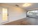 View of an enclosed carport attached to the house with a door leading inside at 6601 E Latham St, Scottsdale, AZ 85257