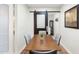 Charming dining area featuring a sliding barn door and modern furnishings at 6601 E Latham St, Scottsdale, AZ 85257