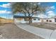 Inviting white brick home with desert landscaping, carport and a welcoming front entrance at 6601 E Latham St, Scottsdale, AZ 85257