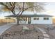 Charming white brick home featuring desert landscaping and an attached carport at 6601 E Latham St, Scottsdale, AZ 85257