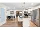 Modern kitchen with white cabinets, stainless steel appliances, and granite countertops at 6601 E Latham St, Scottsdale, AZ 85257