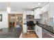 Stylish kitchen featuring stainless steel appliances, gas range, and a view to the back yard at 6601 E Latham St, Scottsdale, AZ 85257