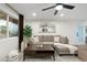 Bright living room with a comfortable sofa, stylish coffee table, and a large window at 6601 E Latham St, Scottsdale, AZ 85257