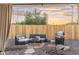 Covered outdoor patio featuring a built-in grill and comfortable seating area at 6601 E Latham St, Scottsdale, AZ 85257