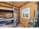 Storage room with shelving and a window for natural light at 6601 E Latham St, Scottsdale, AZ 85257