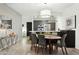 Modern dining area featuring a contemporary table setting, stylish lighting, and access to the kitchen at 7120 E Kierland Blvd # 601, Scottsdale, AZ 85254