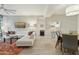 Bright living room featuring modern decor, a sectional sofa, stylish rug and light wood-look tile flooring at 7120 E Kierland Blvd # 601, Scottsdale, AZ 85254