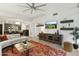 Bright living room with a ceiling fan, stylish furniture, and an open layout leading into the kitchen at 7120 E Kierland Blvd # 601, Scottsdale, AZ 85254