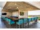 Outdoor kitchen and bar area with community seating and scenic views at 7120 E Kierland Blvd # 601, Scottsdale, AZ 85254