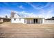 Backyard with a covered patio, providing space for outdoor entertaining and relaxation at 713 E Eason Ave, Buckeye, AZ 85326