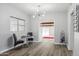 Dining area showcasing modern lighting and elegant decor. Includes a wine rack and a view into another room at 713 E Eason Ave, Buckeye, AZ 85326