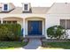 Charming home entrance with a vibrant blue front door at 713 E Eason Ave, Buckeye, AZ 85326