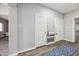 Hallway with a vintage fold-down desk and wood-look flooring at 713 E Eason Ave, Buckeye, AZ 85326