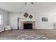 Bright living room with a stone fireplace and large windows at 713 E Eason Ave, Buckeye, AZ 85326