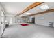 Expansive living room featuring exposed wood beams and plenty of natural light at 713 E Eason Ave, Buckeye, AZ 85326