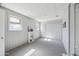 Living room with bright natural light and gray carpet at 713 E Eason Ave, Buckeye, AZ 85326