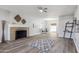 Open-concept living room with a fireplace and a view into the dining area at 713 E Eason Ave, Buckeye, AZ 85326