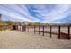 A beautiful backyard with desert landscaping and secure fencing at 725 W Hermosa Dr, Wickenburg, AZ 85390