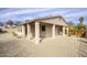 Spacious home featuring a covered patio and low maintenance desert landscaping at 725 W Hermosa Dr, Wickenburg, AZ 85390