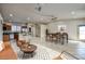 Open living room features tile flooring, neutral color palette, and breakfast bar at 725 W Hermosa Dr, Wickenburg, AZ 85390