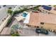 Aerial view of a home with a pool, covered patio, and driveway at 7365 W Via Del Sol Dr, Glendale, AZ 85310