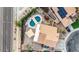 An aerial view of a home with a pool, patio, and solar panels at 7365 W Via Del Sol Dr, Glendale, AZ 85310