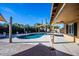 Backyard featuring a kidney-shaped pool with a covered patio at 7365 W Via Del Sol Dr, Glendale, AZ 85310