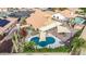 Aerial view of backyard pool, patio, and lush landscaping at 7365 W Via Del Sol Dr, Glendale, AZ 85310