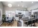 Spacious eat-in kitchen offers modern amenities and ample counter space and white cabinetry at 7365 W Via Del Sol Dr, Glendale, AZ 85310