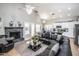 Bright and airy living space with a corner fireplace that flows to the kitchen at 7365 W Via Del Sol Dr, Glendale, AZ 85310