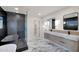 Sleek bathroom with double vanity, glass shower, and modern fixtures at 743 E Sierra Vista Dr, Phoenix, AZ 85014