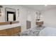 Elegant bathroom with double vanity, marble floors, modern fixtures, and a freestanding tub at 743 E Sierra Vista Dr, Phoenix, AZ 85014