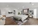 Bright main bedroom with a large picture window, ensuite bath and hardwood floors at 743 E Sierra Vista Dr, Phoenix, AZ 85014