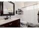 Bathroom features a vanity with a dark wood cabinet and an enclosed shower at 7952 E Teton Cir, Mesa, AZ 85207