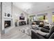 Living room features a fireplace, mantel, and comfortable seating at 7952 E Teton Cir, Mesa, AZ 85207