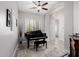 Living room with wood floors and a grand piano at 7952 E Teton Cir, Mesa, AZ 85207