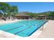 Community lap pool featuring mountain views and mature trees at 7952 E Teton Cir, Mesa, AZ 85207