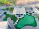 Backyard fun with putting green and covered patio at 7952 E Teton Cir, Mesa, AZ 85207