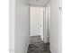 Hallway with wood-look flooring leading to another room in a home at 815 N Hayden Rd # B109, Scottsdale, AZ 85257