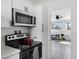 Cozy kitchen leading into a well-lit living room at 815 N Hayden Rd # B109, Scottsdale, AZ 85257