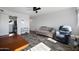 Living room with wood-look flooring and comfortable seating at 815 N Hayden Rd # B109, Scottsdale, AZ 85257