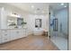 Bathroom featuring a soaking tub, double vanity, modern fixtures, and a glass door shower at 8254 E Juan Tabo Rd, Scottsdale, AZ 85255