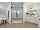 Bathroom with a marble-tiled shower, modern fixtures, and a white vanity at 8254 E Juan Tabo Rd, Scottsdale, AZ 85255