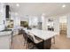 Modern kitchen featuring an oversized island with bar seating and updated stainless steel appliances at 8254 E Juan Tabo Rd, Scottsdale, AZ 85255