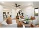 Bright living room showcasing wood floors and cozy seating with accent pillows at 8254 E Juan Tabo Rd, Scottsdale, AZ 85255