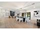 Spacious living room with fireplace flowing seamlessly into the dining area at 8254 E Juan Tabo Rd, Scottsdale, AZ 85255