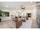 Open living room featuring a dark marble fireplace and light wood-look flooring at 8254 E Juan Tabo Rd, Scottsdale, AZ 85255